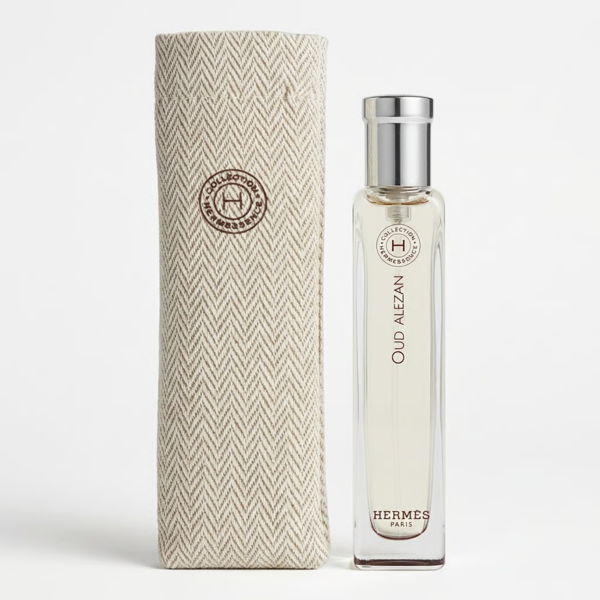 Hermes perfume bottle and packaging on a light gray background