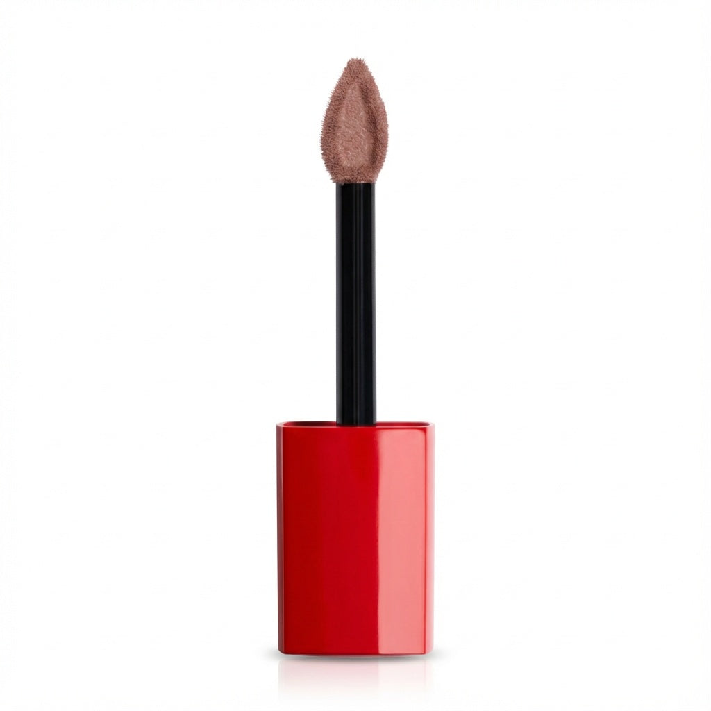 A cosmetic lip gloss or liquid lipstick with a glossy red cylindrical cap, a black wand applicator, and a soft, teardrop-shaped tip showing a nude pinkish-brown color, set against a plain white background.